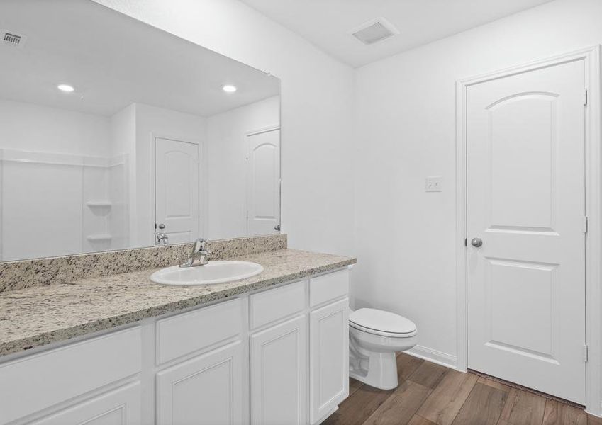 The master bath has a long vanity perfect for getting ready each day