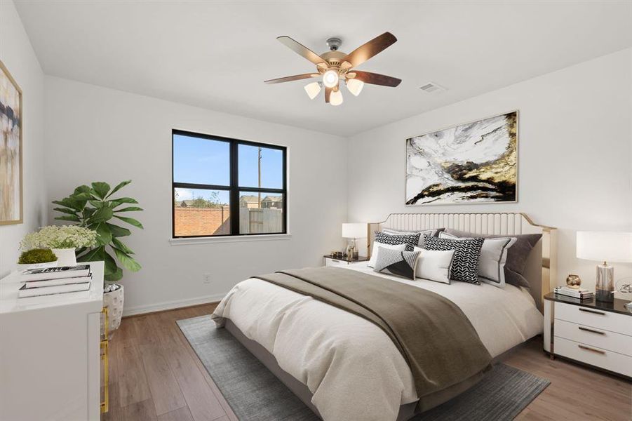 The primary bedroom is generously sized, creating a tranquil and spacious retreat that offers ample room for relaxation. Featuring sleek floors, ceiling fan with lighting, fresh paint, and large windows that lets in natural lighting throughout the day.