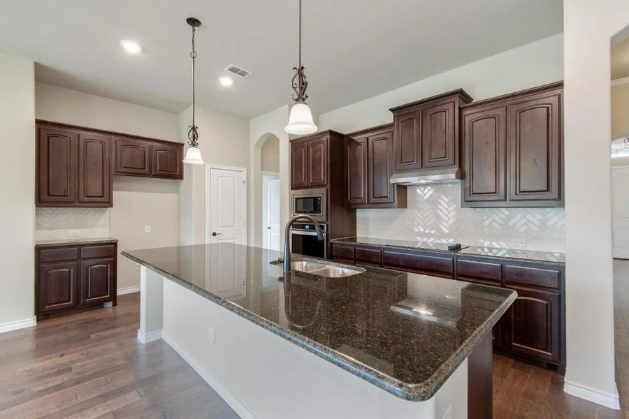 Kitchen | Concept 2671 at Oak Hills in Burleson, TX by Landsea Homes