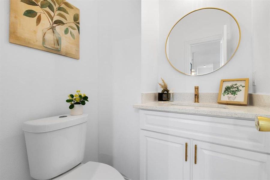 Bathroom featuring vanity and toilet