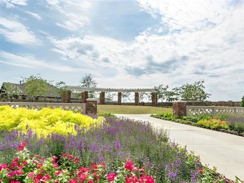 This beautiful landscaping at 1515 Carson Field Lane creates a serene outdoor space, perfect for relaxing after a long day.