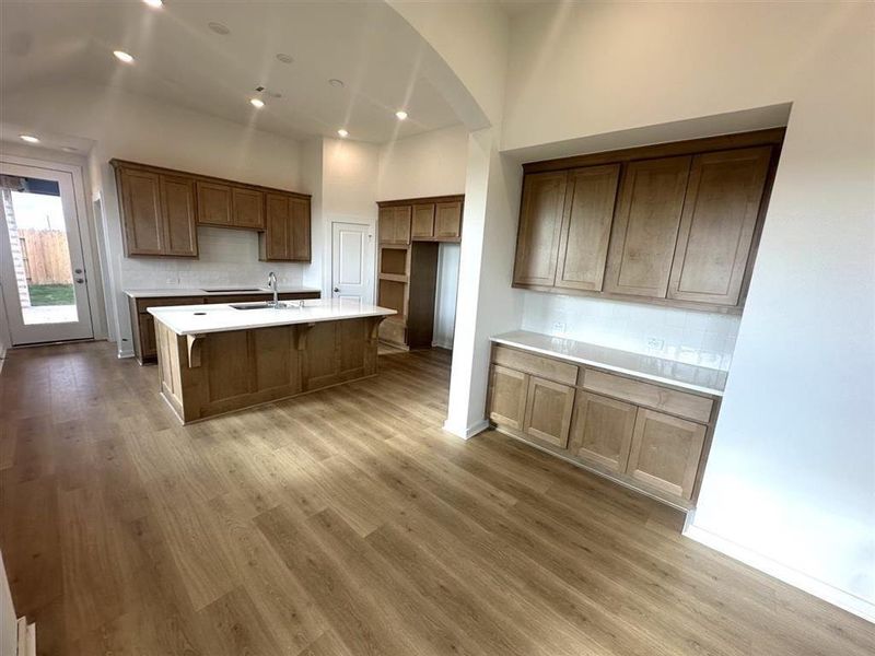 Dining area has built in hutch with beautiful quartz countertop and upgraded tiling.