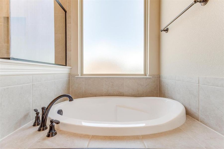 Bathroom with a tub to relax in