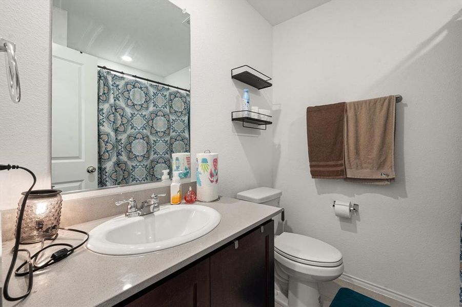 Bathroom with vanity and toilet