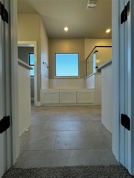 Bathroom featuring tile walls