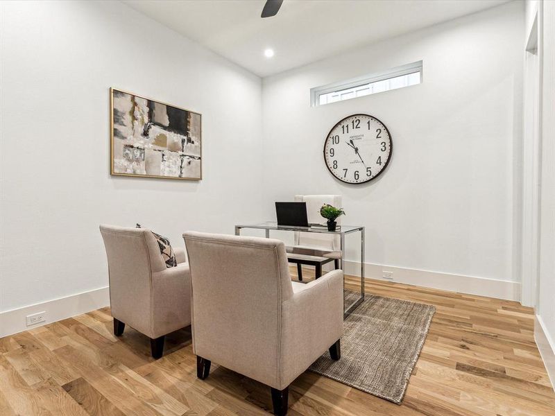 Office area featuring hardwood / wood-style flooring