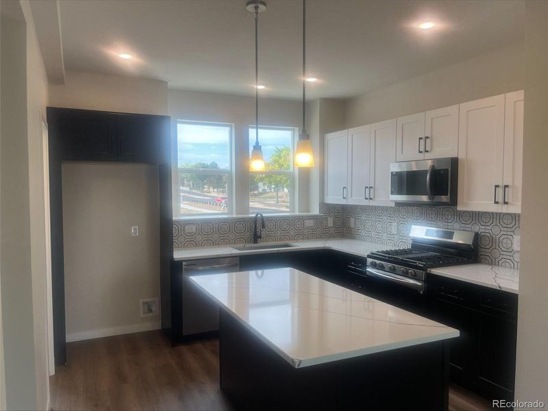 Quartz countertop, upgraded cabinets and appliances