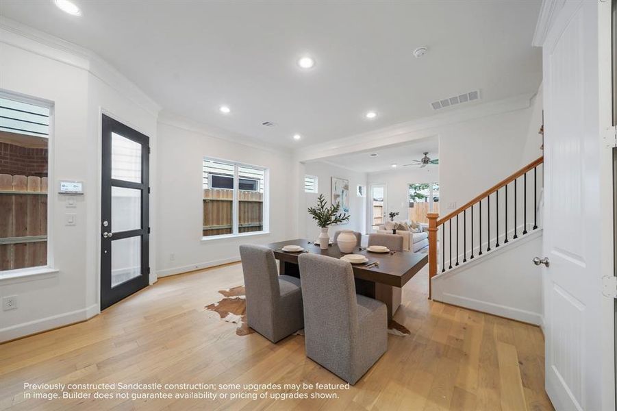 Central Sophistication: Right where family and friends converge, this dining room is the true heart of the home, bathed in welcoming natural light.