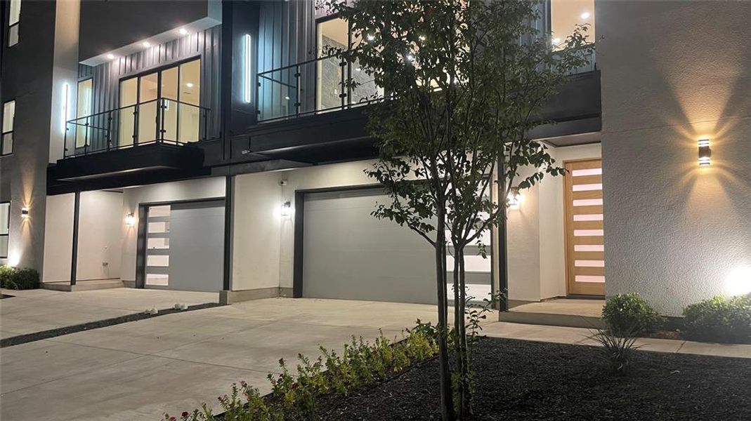 Entrance to property with a balcony and a garage