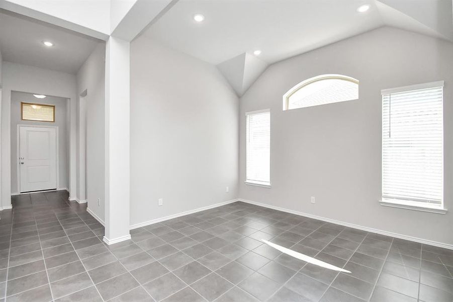 Formal dining area with large windows