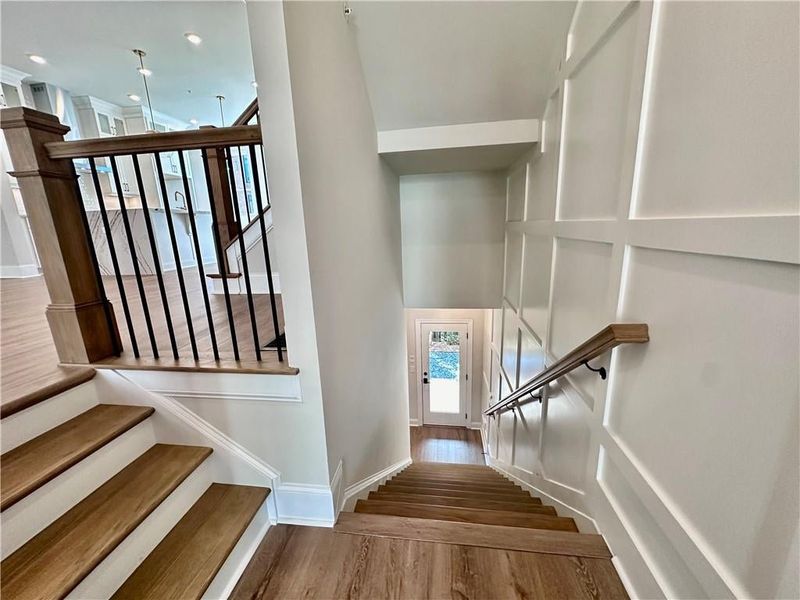 Split staircase lead down to the terrace level bedroom plus outdoor access