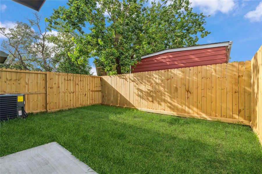 Enjoy a private backyard retreat, ideal for relaxation and outdoor gatherings. This tranquil space offers privacy and a serene atmosphere, perfect for enjoying the outdoors in peace.