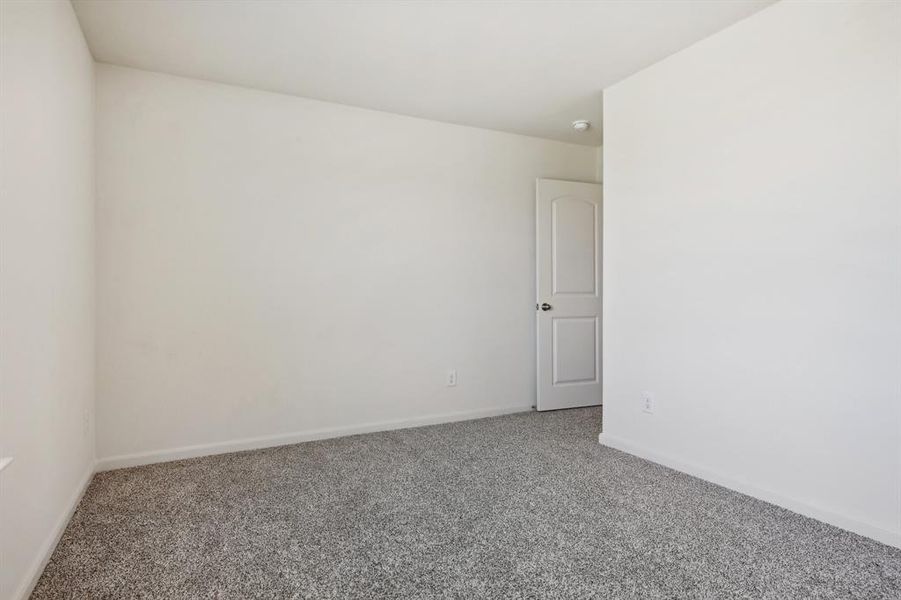 Spare room featuring carpet floors