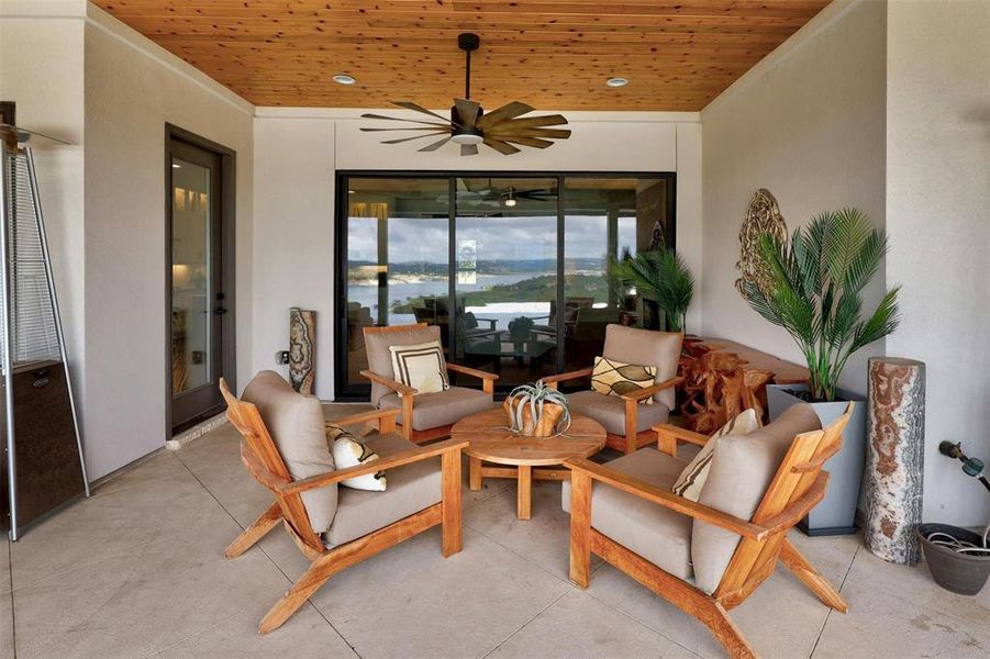 Outdoor living area complete with cedar ceiling and built in fans.