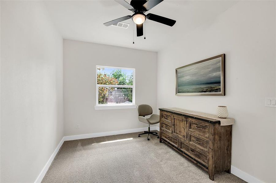 Carpeted 2nd Bedroom with ceiling fan