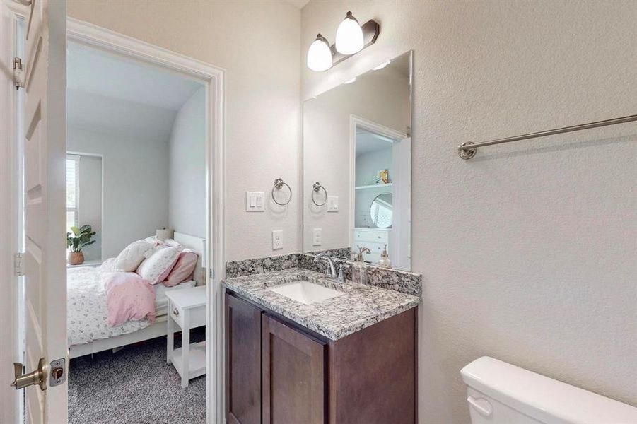 Bathroom featuring vanity and toilet