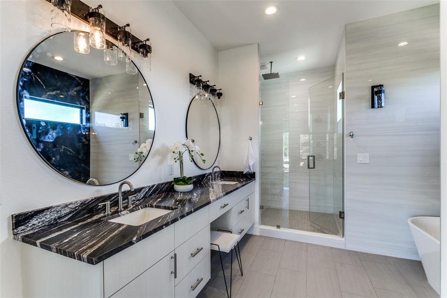 Bathroom with vanity, tile patterned floors, and shower with separate bathtub