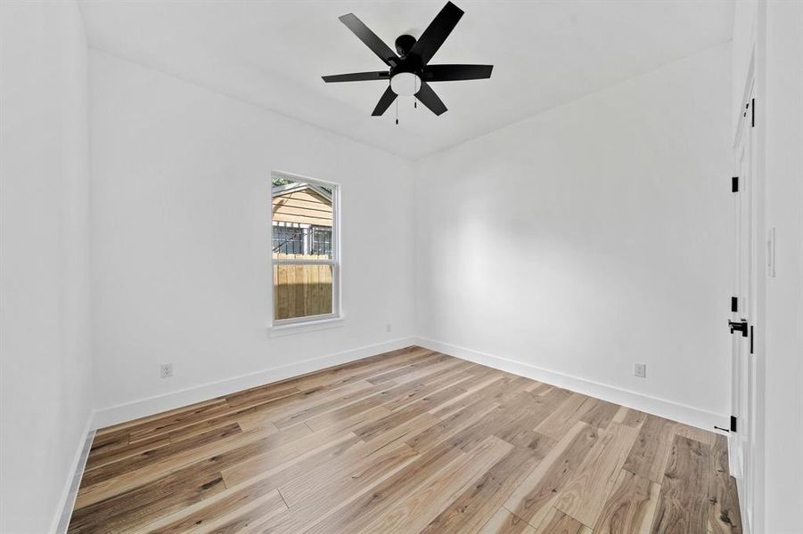 Unfurnished room featuring light hardwood / wood-style floors and ceiling fan