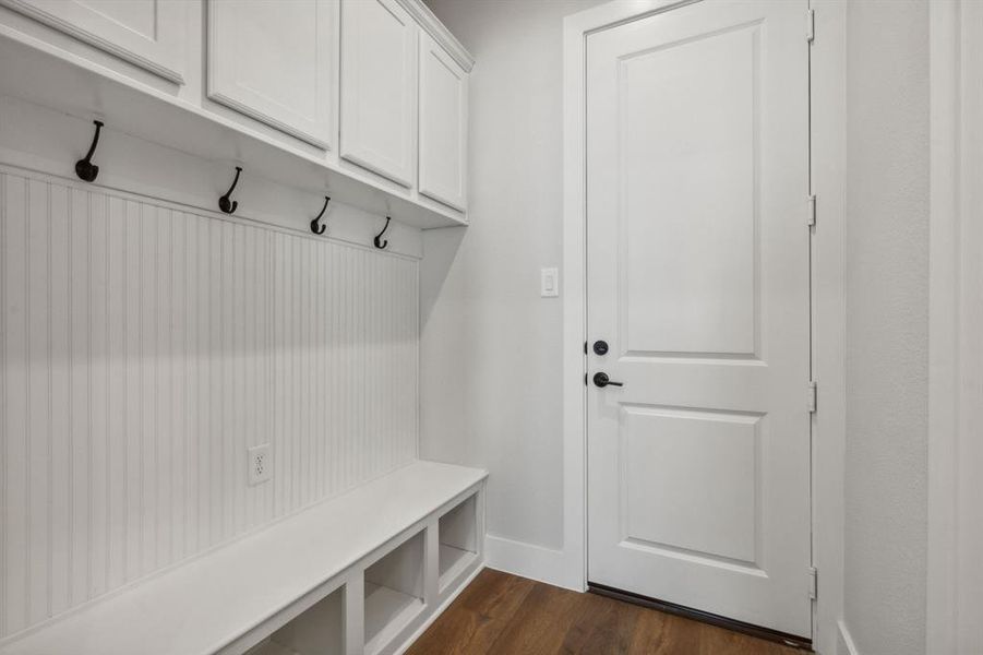 Mudroom featuring dark wood-type flooring