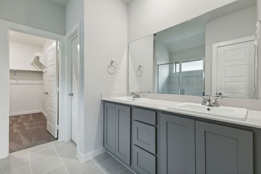 Primary Bathroom in the Oscar home plan by Trophy Signature Homes – REPRESENTATIVE PHOTO