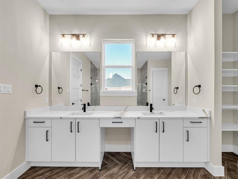 Bathroom with vanity, walk in shower, and wood-type flooring