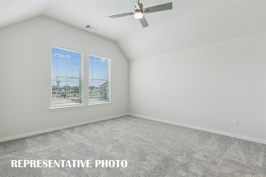 This peaceful light filled owner's bedroom is the perfect place to relax after a long day.  REPRESENTATIVE PHOTO