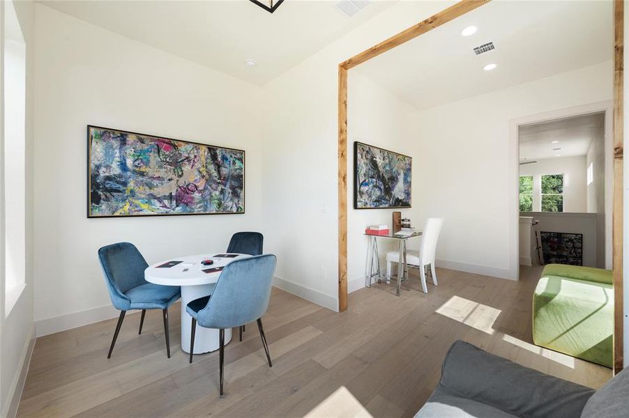 Office area with light wood-type flooring