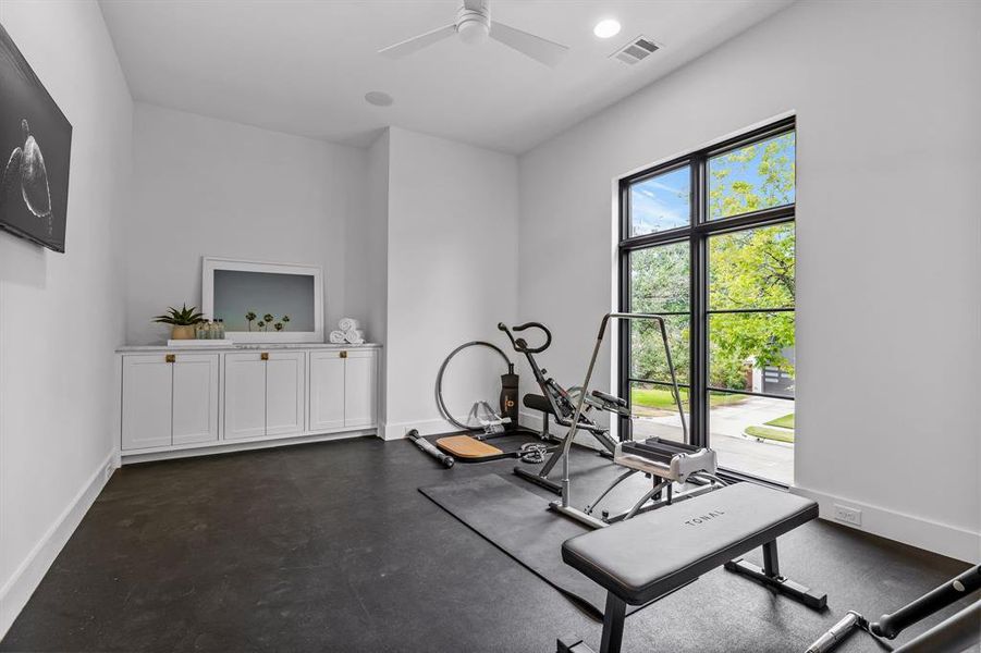 Exercise area featuring ceiling fan