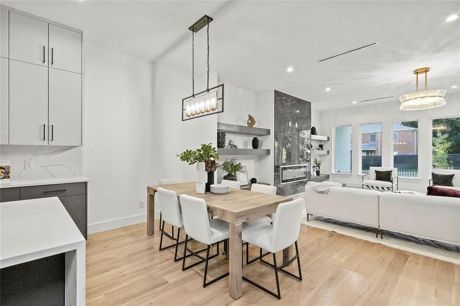 Dining area with light hardwood / wood-style floors