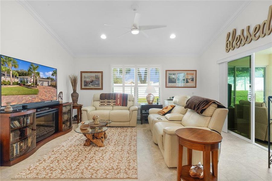 Living Room and Sliders to Glass Enclosed Lanai with Heat/Air.