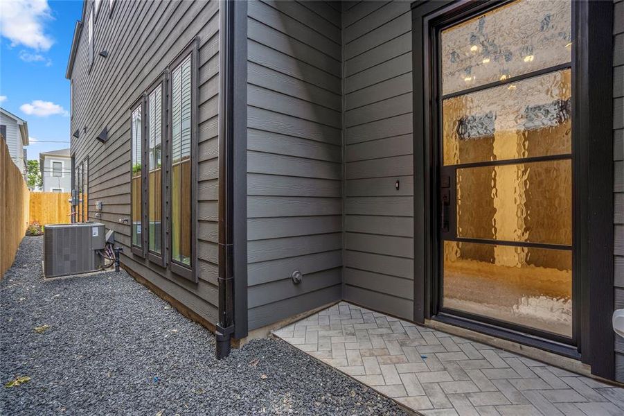 Beautiful herringbone tiled floors greet your friends and family with a gorgeous wrought iron front door. Let's go inside this dream home.
