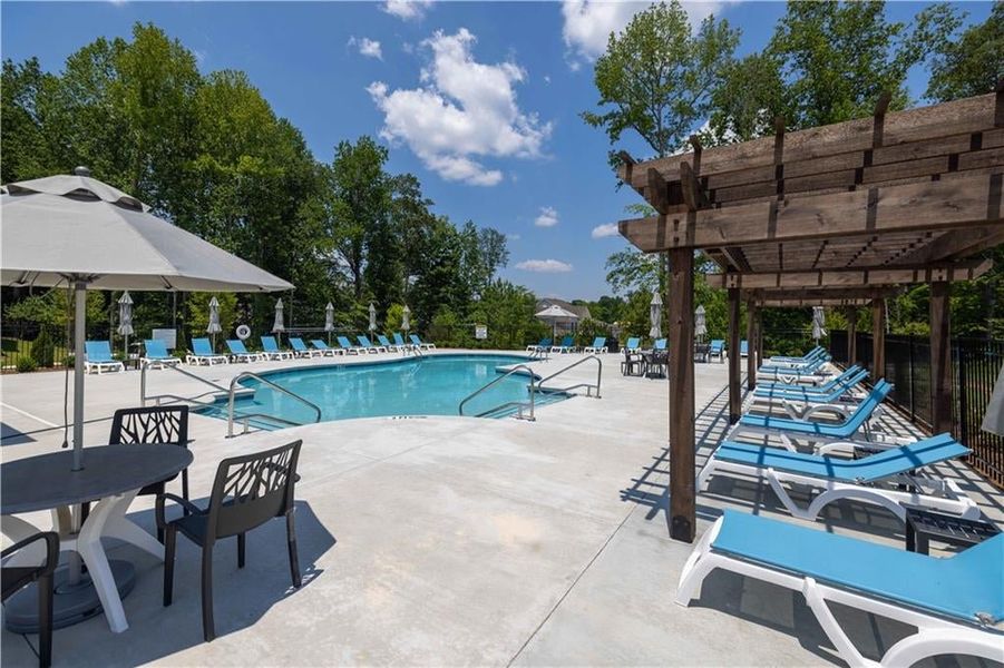 Comfy chairs and trees surrounding the amenity