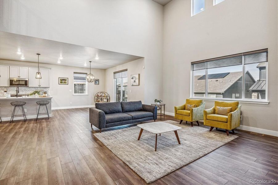 Vaulted ceilings in great room with upper accent windows