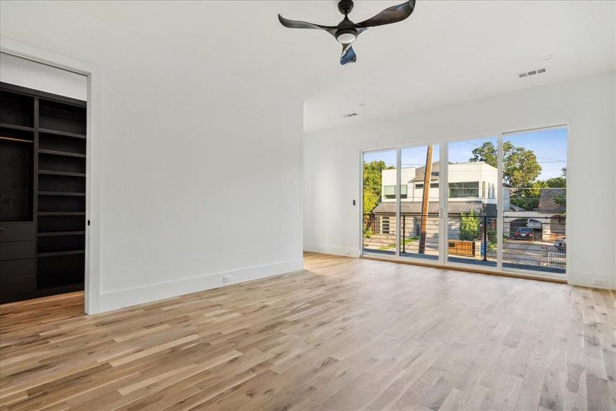 Unfurnished living room featuring light hardwood / wood-style floors and ceiling fan