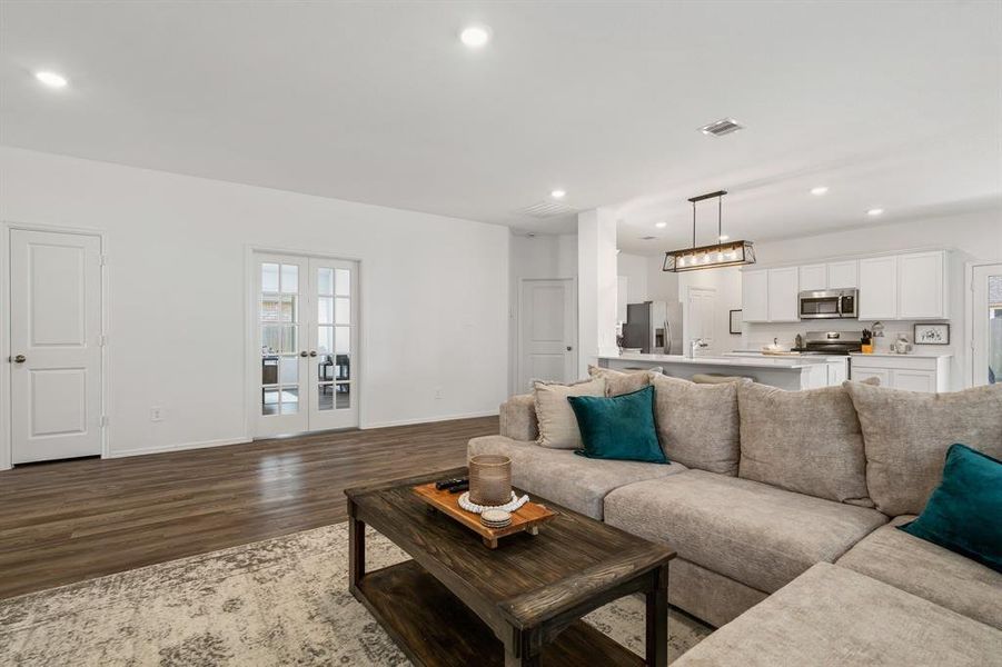 Great room opens to the kitchen and is nice and bright.