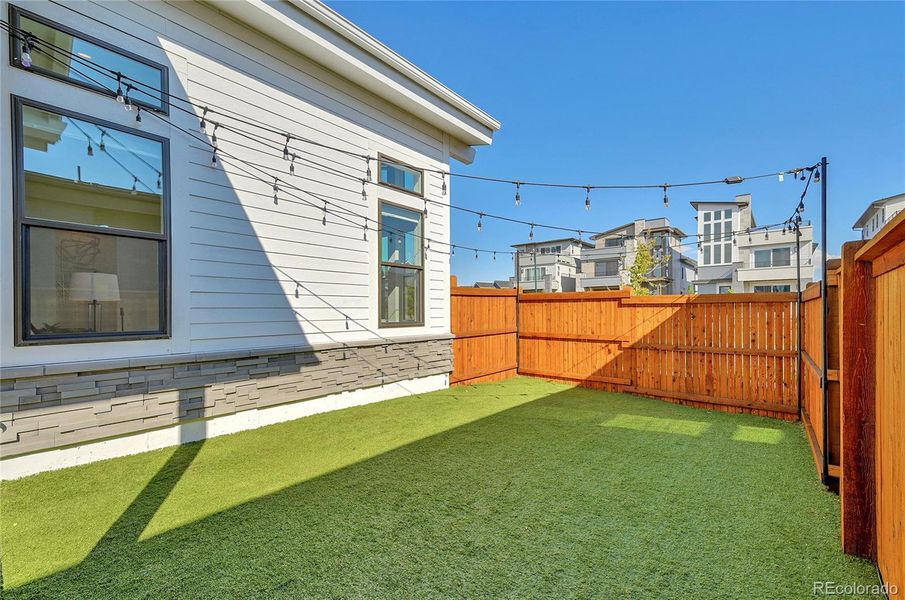 You'll love the low maintenance turf yard!