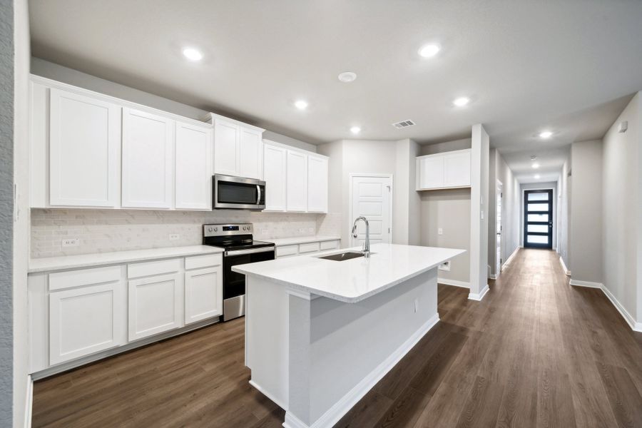 Kitchen in the Reynolds floorplan at a Meritage Homes community.