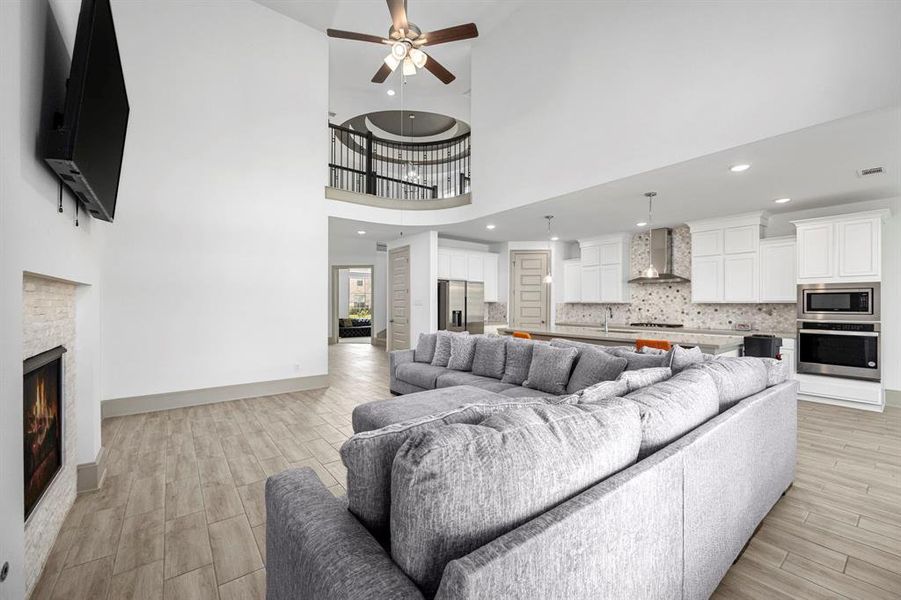 This truly open floor plan connects the kitchen and living room with an amazing overlook from the second floor.