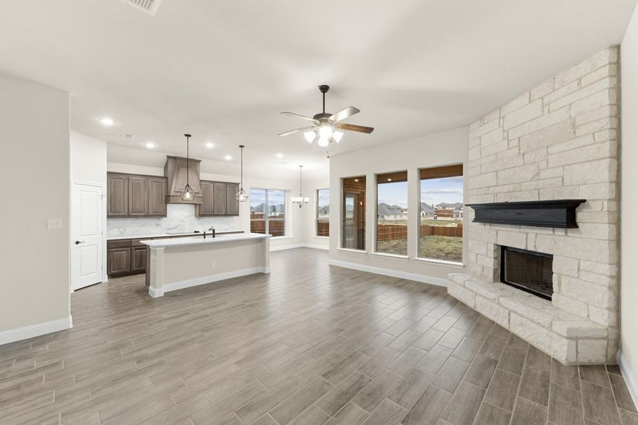 Family Room & Kitchen | Concept 2370 at Massey Meadows in Midlothian, TX by Landsea Homes