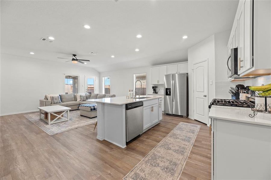 In this open concept design, the kitchen serves as the heart of the home, where meals are prepared, conversations flow, and memories are made.