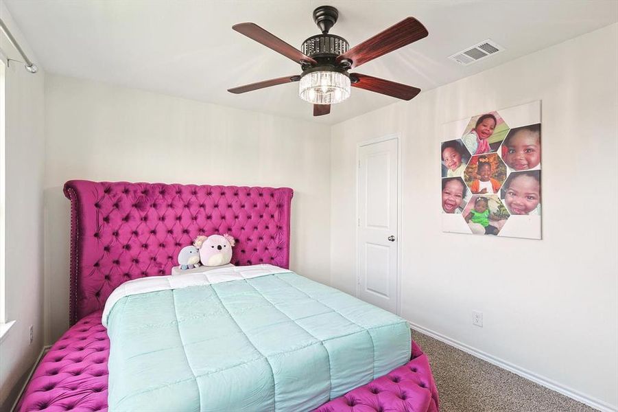 Bedroom with carpet and ceiling fan