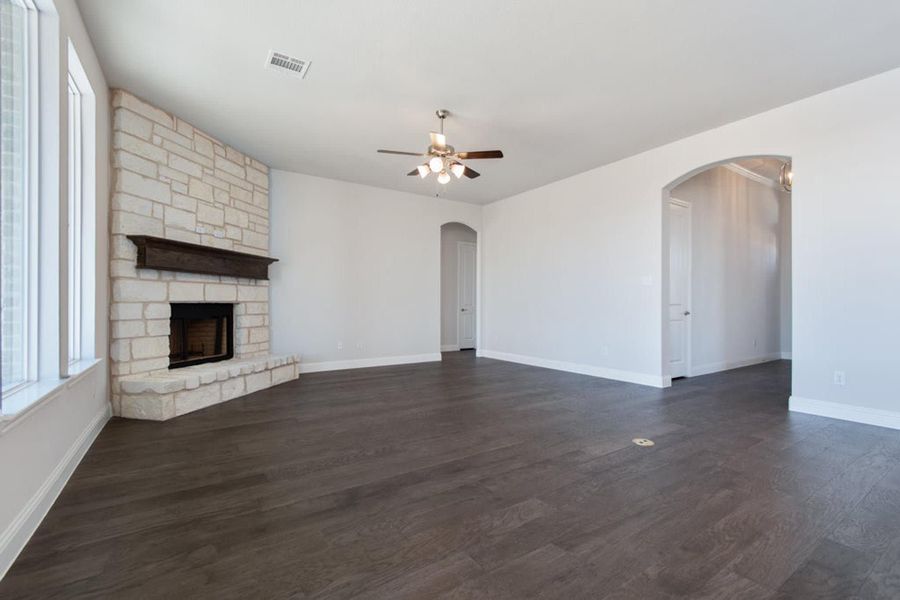 Family Room | Concept 2406 at Hidden Creek Estates in Van Alstyne, TX by Landsea Homes