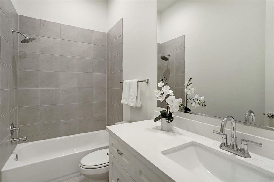 First floor bathroom with tub/shower combination...