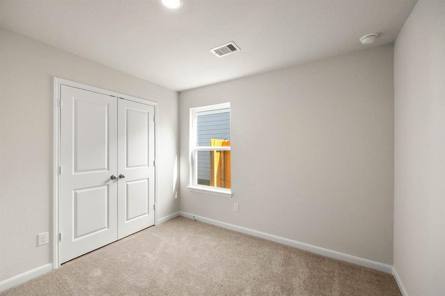 The secondary bedroom would make a perfect space for a guest room or office space.