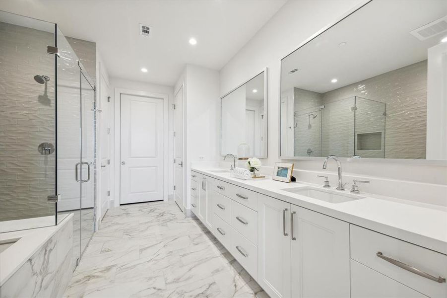 The primary bath is gorgeous with walk-in shower, Toto toilet, linen closet, and connects to the incredible primary closet with vanity.