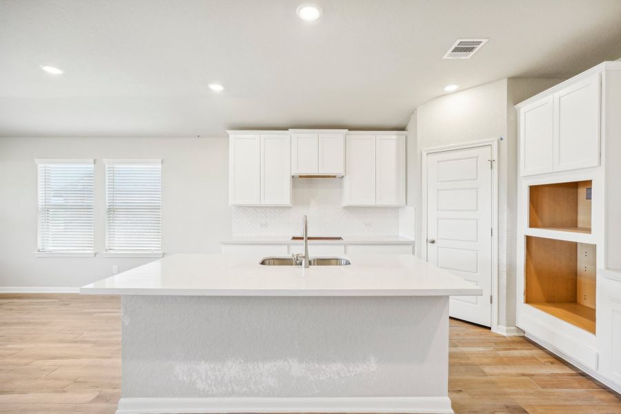 Kitchen in the Fitzhugh floorplan at a Meritage homes community.