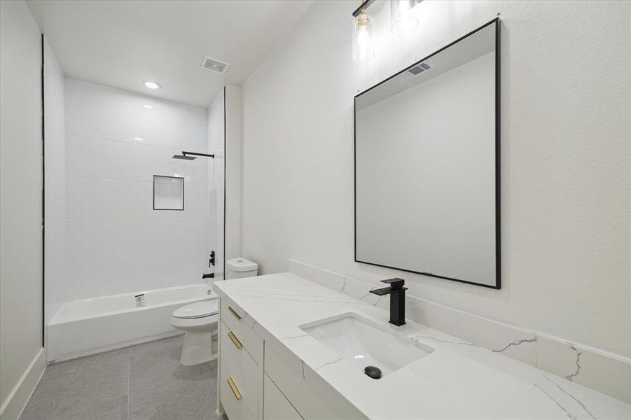 Modern bathroom featuring sleek fixtures and elegant finishes.