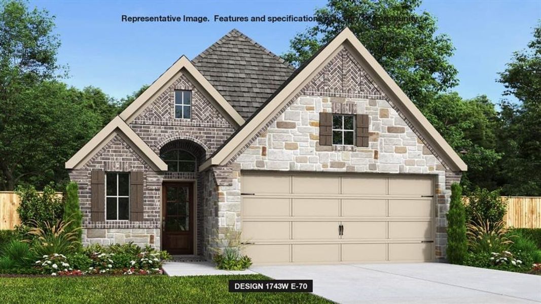 View of front facade featuring a garage