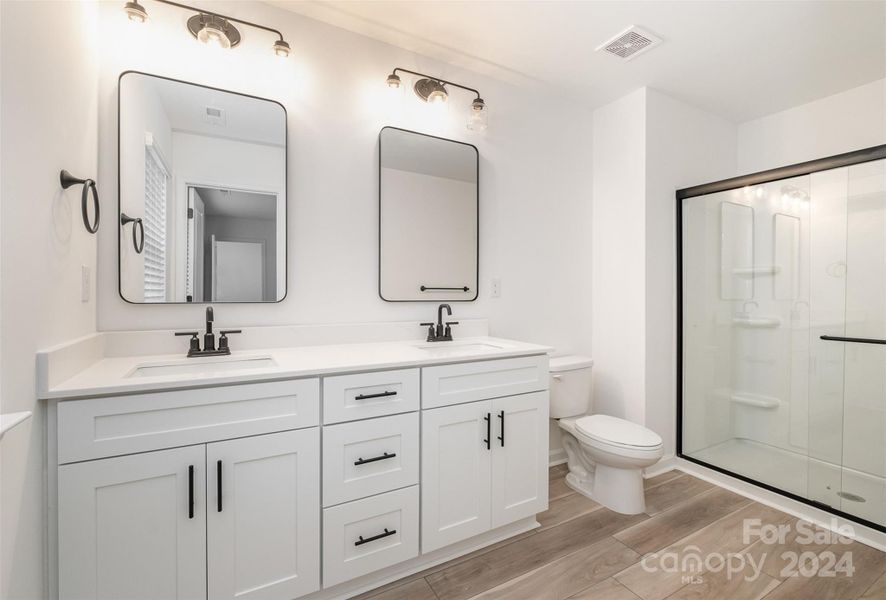 Representative Photo. Double vanity w/ quartz countertops