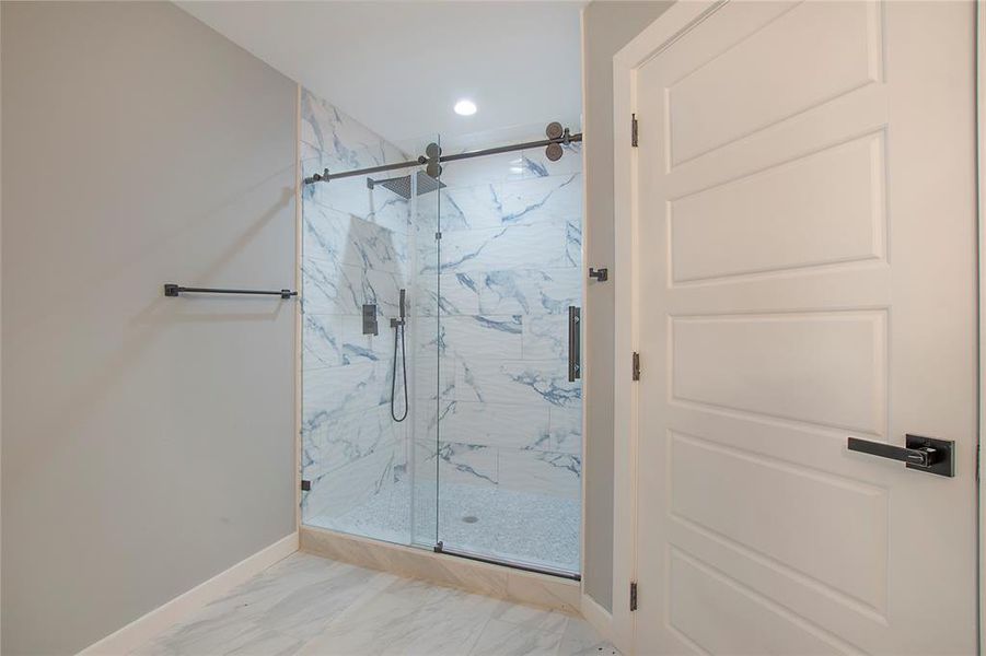 Bathroom with a shower with door